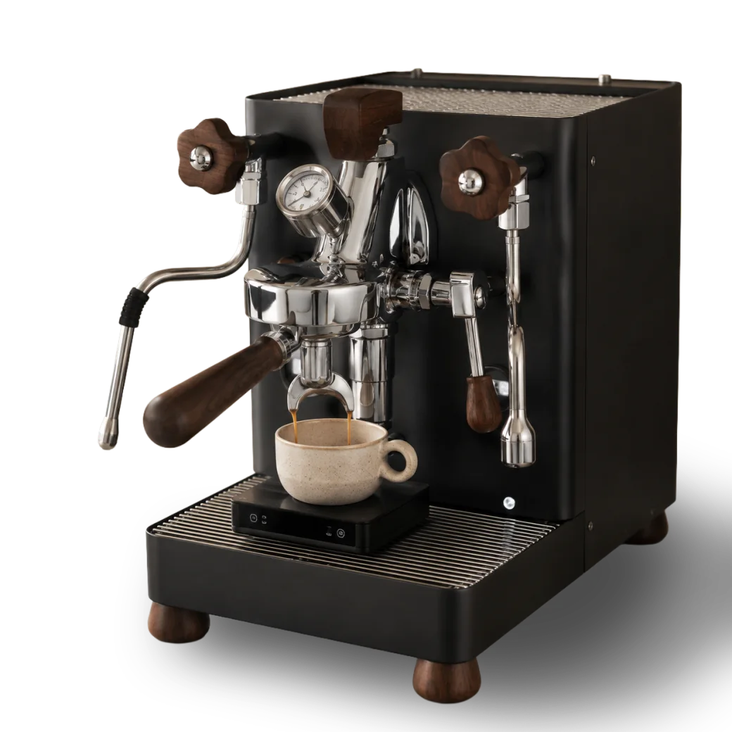 Matte black espresso machine pulling through a bottomless portafilter into a cup.